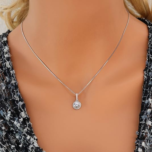 Round solitaire pendant with a sparkling double halo.