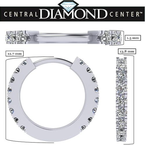 Model wearing round huggie hoop earrings.