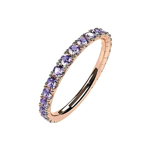 Close-up of gold plated stackable ring with round gems.