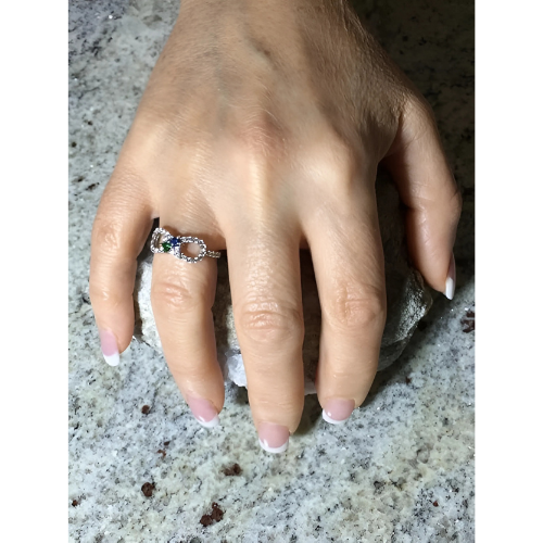 Close-up of 14K Gold Infinity Couples Ring with gems.