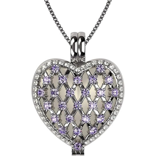 Detail of heart shaped locket and gemstone.