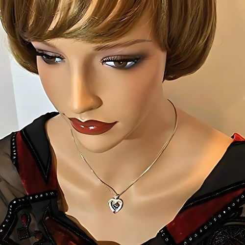 10K gold couples pendant with glittering accents.