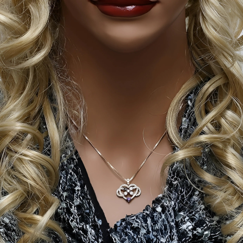 Model wearing sterling silver mother & child necklace.