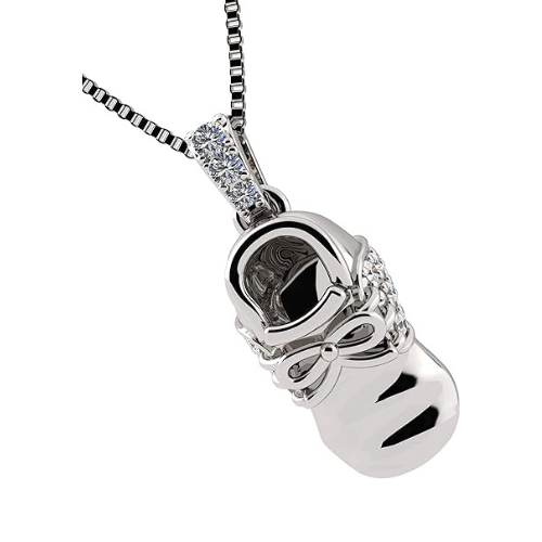 Close-up of a pure brilliance zirconia in gold baby shoe.