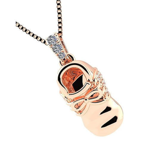 Sentimental gold baby shoe necklace on display.