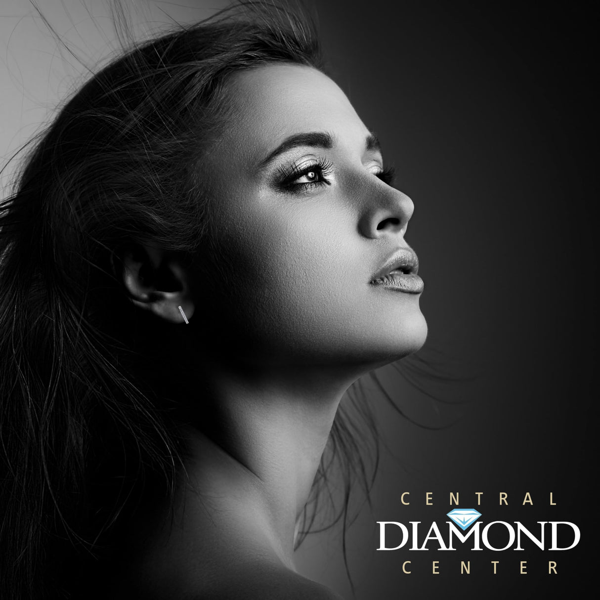 Front view of solid silver huggie hoops.