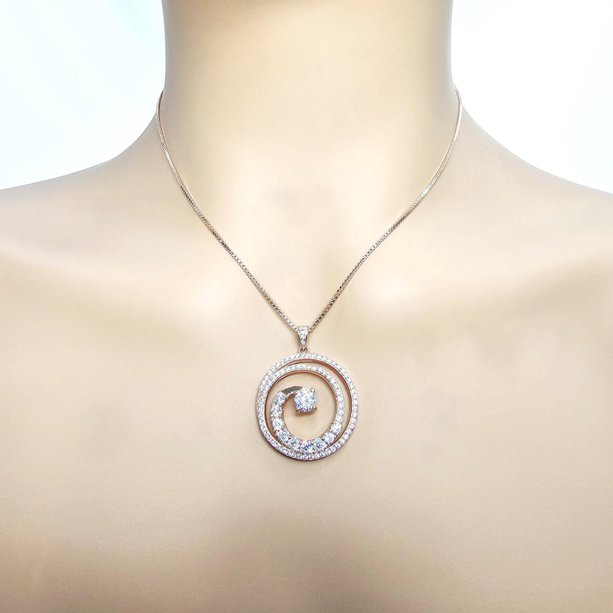 Detailed view of the elegant swirl design and central diamond
