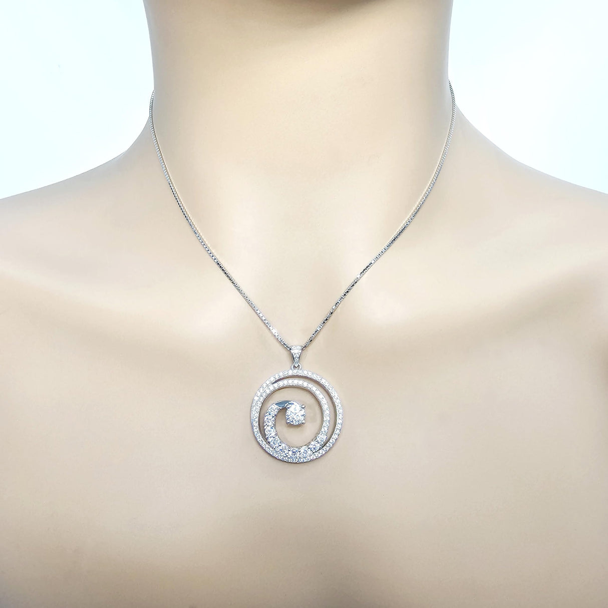 Gorgeous swirl necklace with a sparkling simulated diamond.