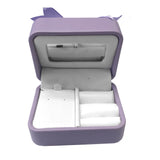Lilac multi-department jewelry box for necklaces, rings, and earrings.