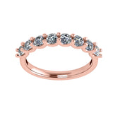 Silver wedding band with a brilliant cut simulated diamond.