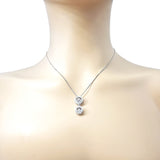 Double halo dancing gemstone necklace on display.