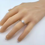 10k gold solitaire engagement ring with a round brilliant simulated diamond.