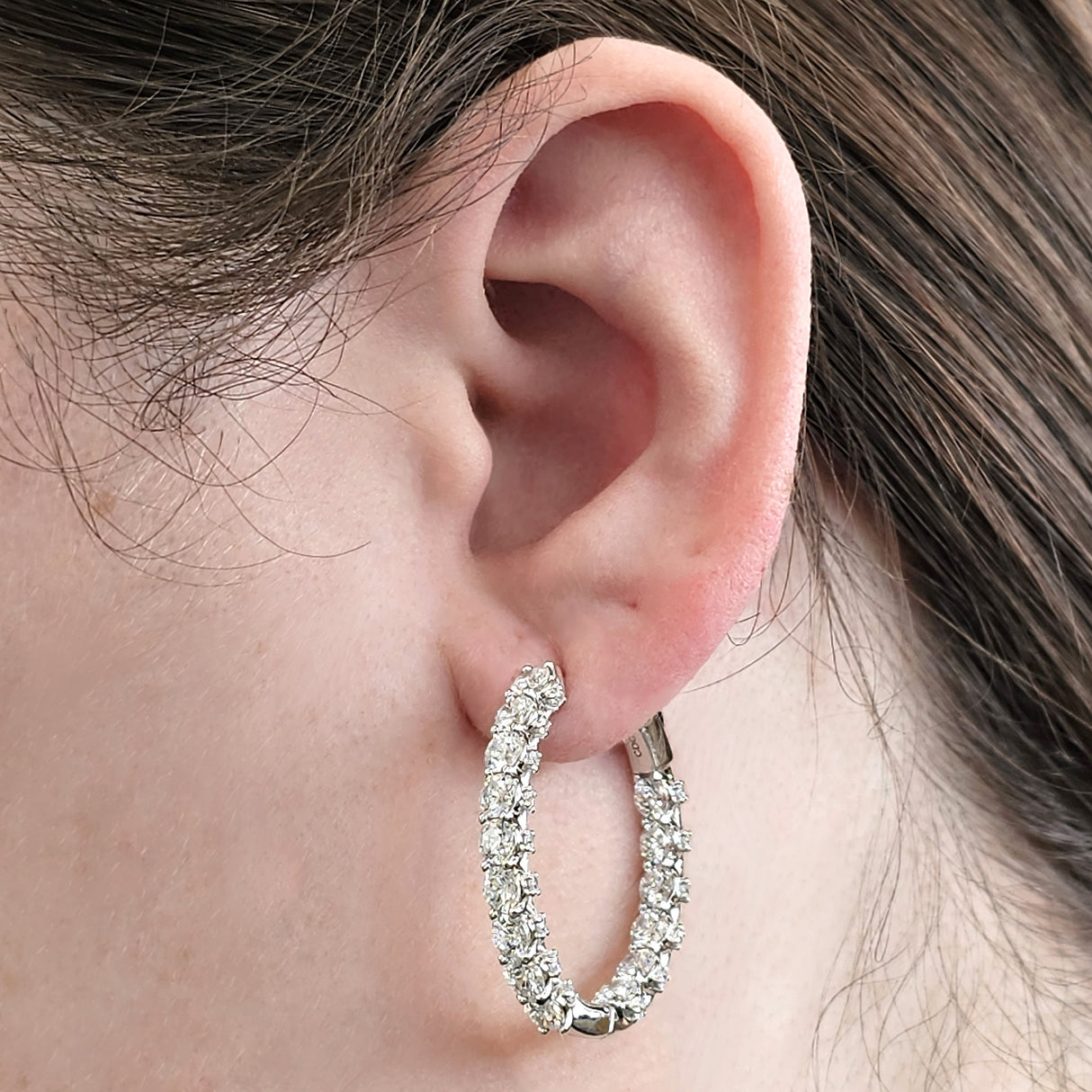 Close-up of Zsa Zsa oval hoop earring design.