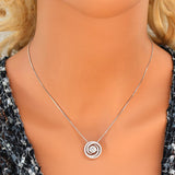 Circle Swirl pendant with moving zirconia.