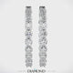 Solid 925 sterling silver oval hoop earrings on display.
