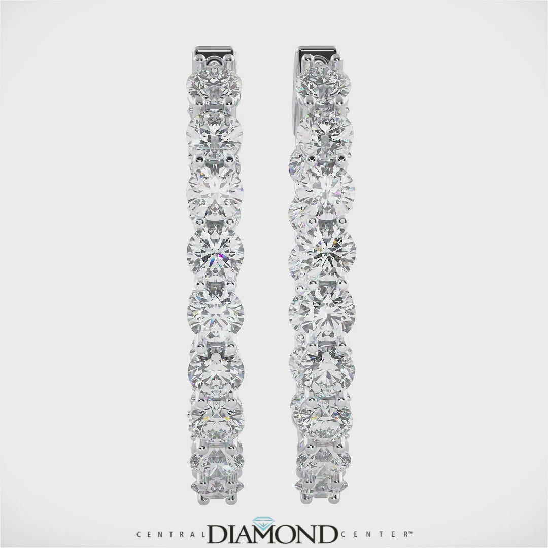 Solid 925 sterling silver oval hoop earrings on display.